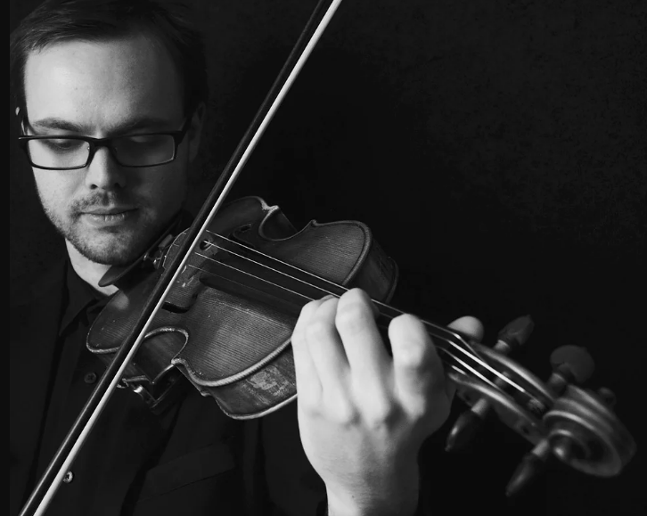 Arlo Adams playing violin.